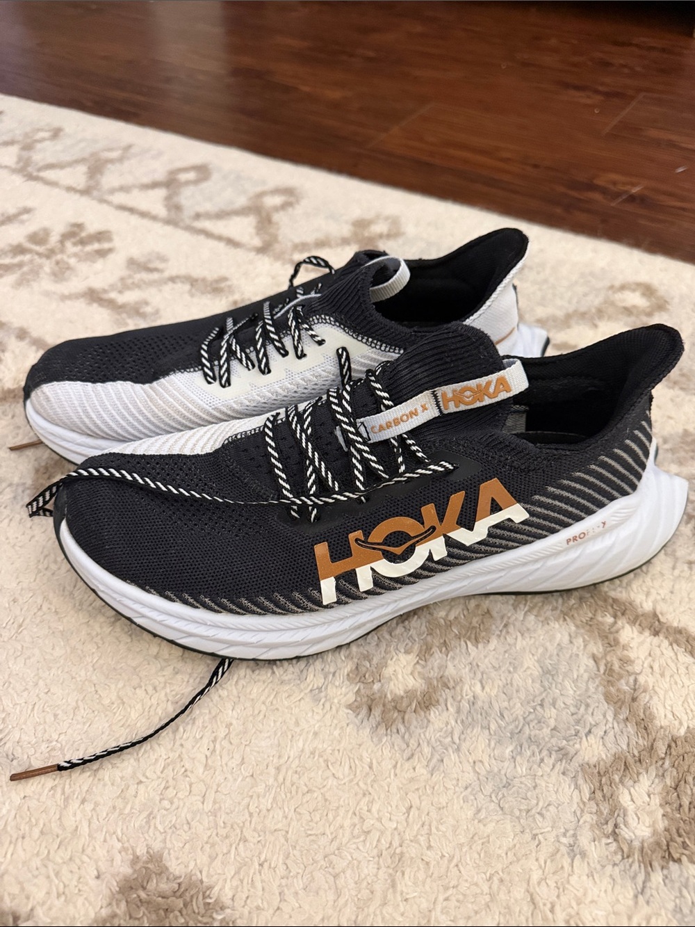 Hoka Men's Black & White Running Shoes with Gold Logo